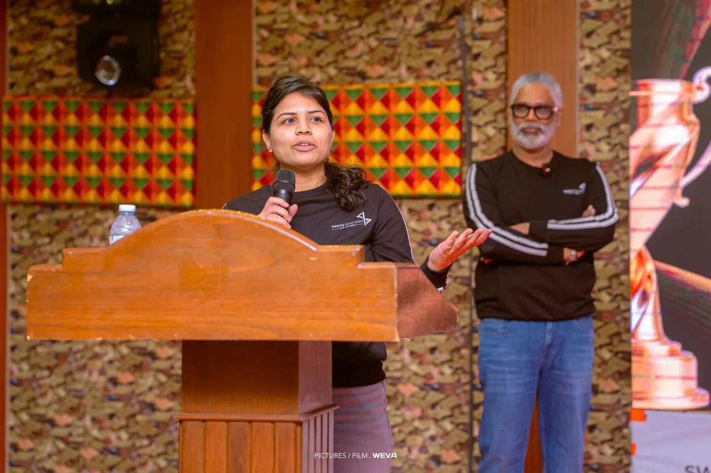 Announcing the honours from the podium